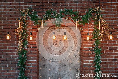 Christmas decorations over the decorative fireplace on the wall Stock Photo