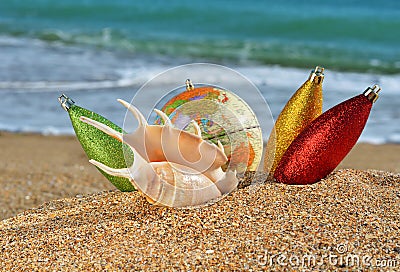 Christmas decorations and seashell on the beach Stock Photo