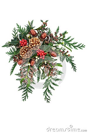 Christmas Decorative Display with Holly and Winter Flora Stock Photo