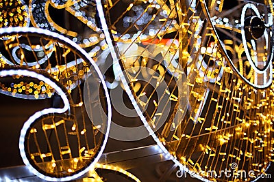 Waterproof warm electric garland with white border on city street in evening Stock Photo