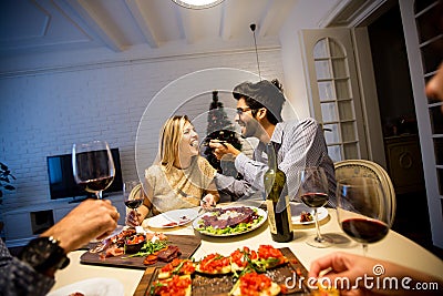 Christmas dinner in the beautifully decorated New Year interior Stock Photo