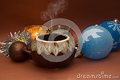 Christmas dinner: ceramic pot of hot steaming food Stock Photo