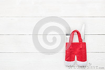 Christmas dinner table setting with fork, knife on white wooden texture. Flat lay Stock Photo