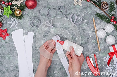 Christmas diy craft, making three-dimensional paper decor for decorating a room. Step-by-step instructions. Step 29- start making Stock Photo