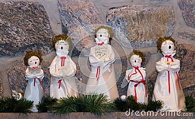Christmas dolls singing carols Stock Photo
