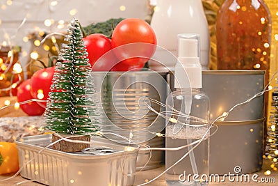 Christmas donations - food and medicines donations with bokeh ligths on background - canned food, sanitizer with Christmas Stock Photo