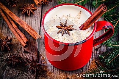 Christmas drink: hot white chocolate with cinnamon and anise in red mug Stock Photo