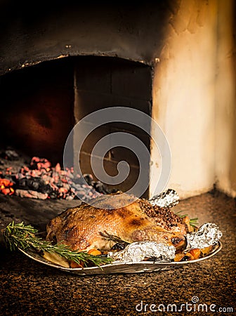 Appetizing baked duck stuffed with buckwheat and apples. Stock Photo