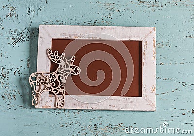 Christmas empty picture frame and decorative Christmas deer Stock Photo
