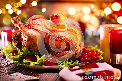 Christmas family dinner. Christmas holiday decorated table with turkey Stock Photo