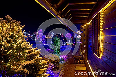 Christmas fantasy - wooden house in lights Stock Photo