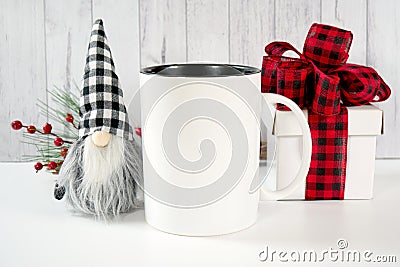 Christmas Farmhouse style product mockup with red plaid bow gift and gnomes. Stock Photo