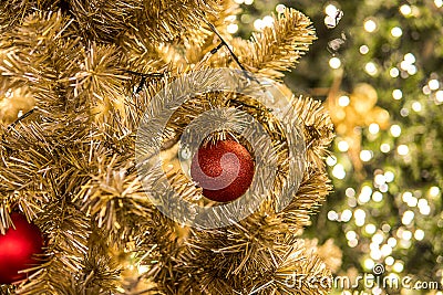 Christmas festival in Bangkok. Golden Christmas tree with red b Stock Photo