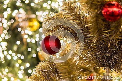 Christmas festival in Bangkok. Golden Christmas tree with red b Stock Photo