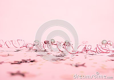 Christmas festive pink background with serpentine and festive toys Stock Photo