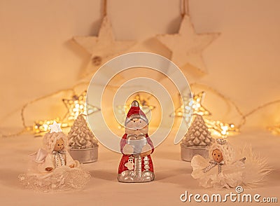Christmas festive scenery showing santa claus and other christmas ornaments in warm golden light Stock Photo