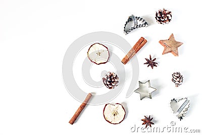 Christmas festive styled food composition, pattern. Pine cones, dried apple fruit, cinnamon, vintage cookie cutters and Stock Photo