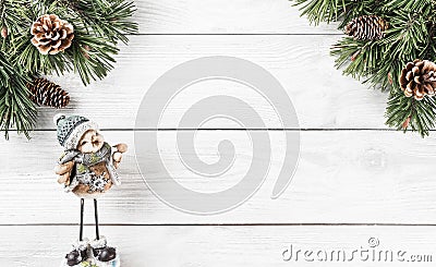 Christmas fir branches with pine cones and Christmas decoration on white wooden background. Xmas and Happy New Year theme. Stock Photo