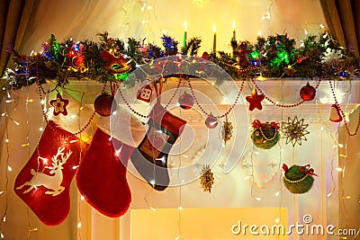 Christmas Fireplace, Family Hanging Socks, Xmas Lights Decoration, Tree Branches Stock Photo