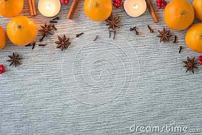 Christmas arrangement of holiday spices, oranges and candles Stock Photo