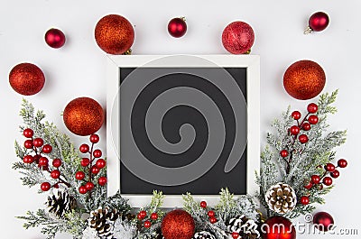 Christmas frame with christmas berry branches decorated with red balls. Flatly trandy mockup. Top view Stock Photo