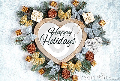 Christmas frame in the shape of a heart is surrounded by branches of a New Year tree Christmas decorations blue and silver, Stock Photo