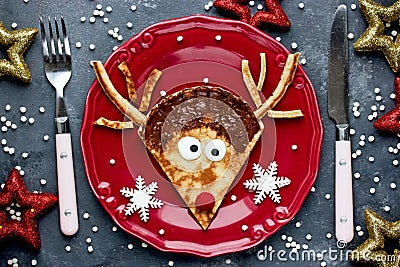 Christmas fun food for kids - reindeer pancake for breakfast Stock Photo