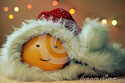 Christmas funny orange with cap Stock Photo