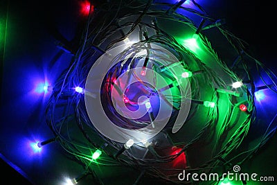 Christmas garland with multi colored bulbs and lights, Christmas, coloured small lights close up Stock Photo