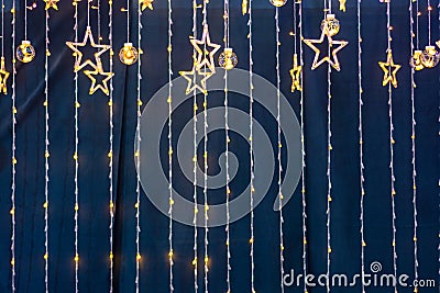 Christmas garlands and stars on a blue background Stock Photo