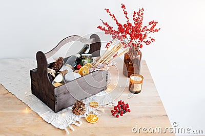 Christmas gift basket with food and decorations. Stock Photo