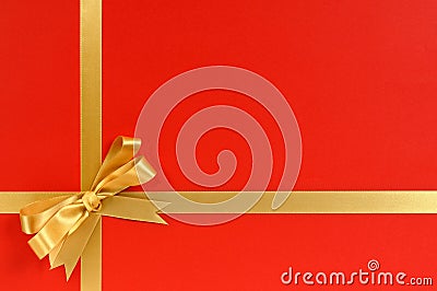 Christmas gift border frame with gold ribbon and bow red background Stock Photo