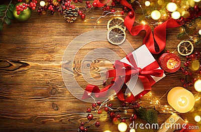 Christmas gift box with red satin ribbon and bow, beautiful Xmas and New Year background with wrapped gift box Stock Photo