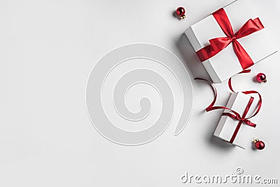 Christmas gift boxes with red ribbon and decoration on white background. Xmas and Happy New Year theme. Stock Photo