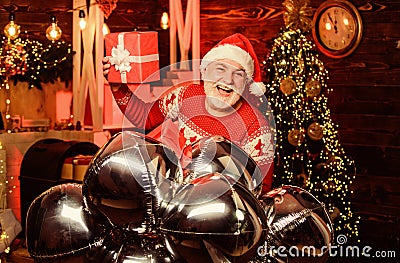 Christmas gift. Celebrate new year. December sale. Surprise concept. Santa Claus delivering gift. Gift shop. Man senior Stock Photo