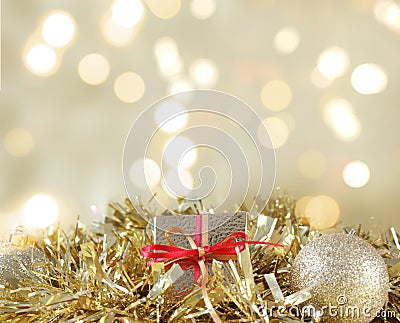 Christmas gift and decorations nestled in gold garland Stock Photo