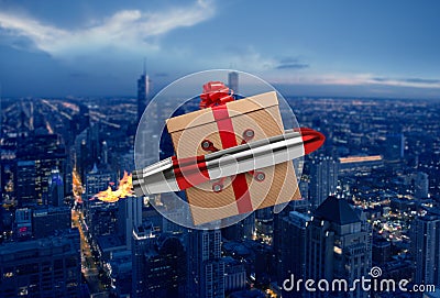 Christmas Gift flies fast by a power rocket over a city Stock Photo