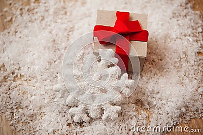 Christmas gift kraft paper and a snowflake in the snow Stock Photo