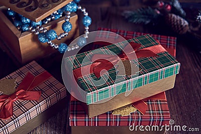 Christmas gifts and casket with Christmas toys on a wooden background. Stock Photo
