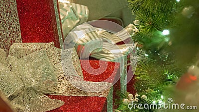 Christmas Gifts Closeup With Tree in Right OF Frame Stock Photo