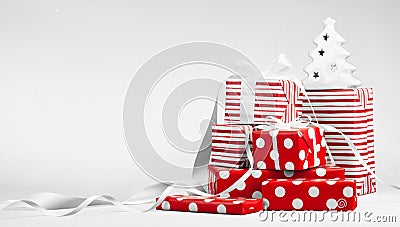 Christmas gifts in red paper with white ribbons Stock Photo