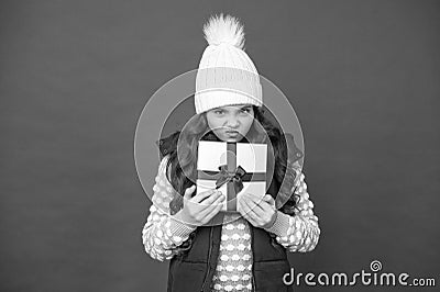 Christmas gifts and souvenirs. prepare for winter holidays. make pleasant things. angry kid in winter outfit red Stock Photo