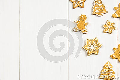 Christmas gingerbread cookies of different shapes on a white wooden table. Copy space. Stock Photo