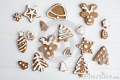 Christmas gingerbread cookies on white wooden background, flat lay Stock Photo