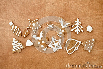 Christmas gingerbread cookies on wooden background, flat lay Stock Photo