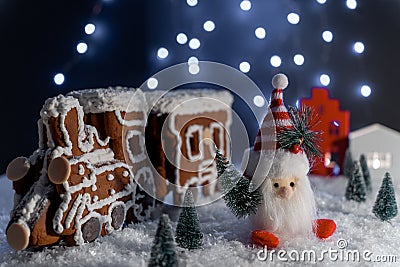 Christmas Gingerbread train with Christmas gnom in wonderland forest. New Year decorations Stock Photo