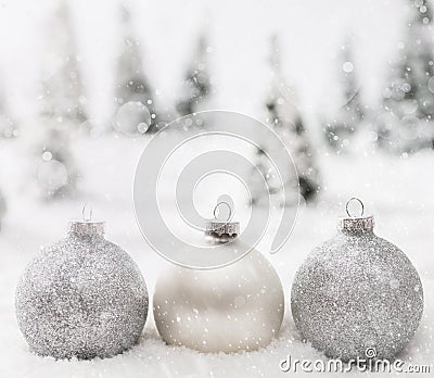 Christmas glass balls in winter miniature forest scenery with snow. Stock Photo