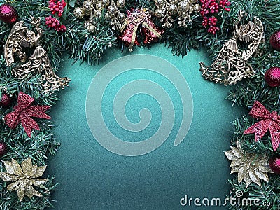 Christmas glittery decors on a fir with green background Stock Photo