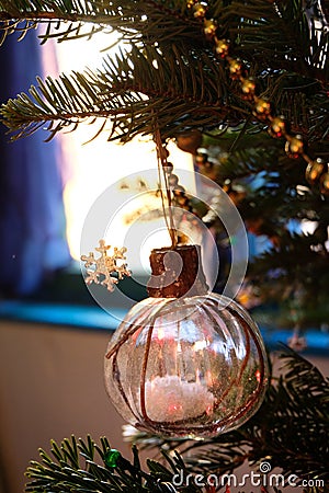 A Christmas globe filled with artificial snowCozy atmosphere Stock Photo