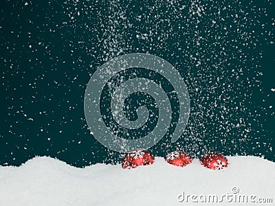 Christmas globes covered in snow Stock Photo